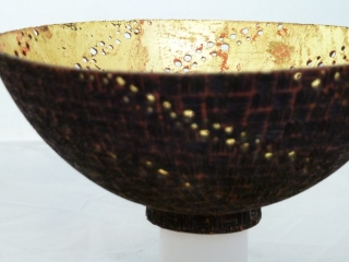 Pierced, pyrograpjhed, stained and gilded bowl