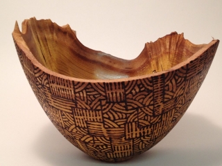 Natural-edged bowl in Mulberry. Pyrographed